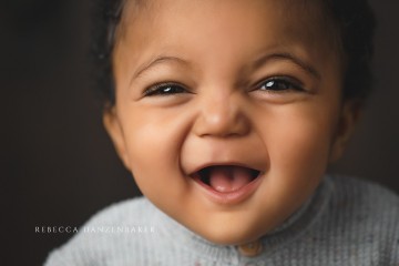 Baby boy laughing during photography session