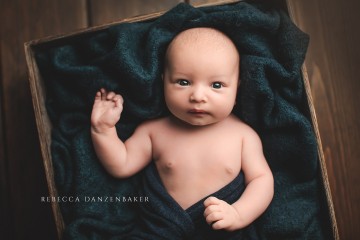 Baby boy wide awake during photography session in Northern VA baby photography studio