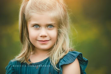 Close up of girl with vivid blue eyes