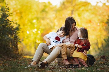 Mother laughing with her two children during a photo session in Northern VA