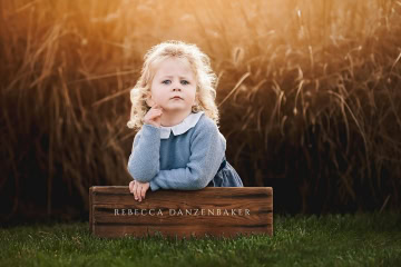 Little girl striking a serious pose for funny portrait