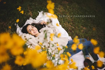 Champe high school senior portrait with yellow flowers