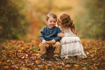 fall portrait of snuggly siblings