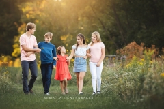 Five siblings walking together during a photo session in Northern VA Five siblings walking together during a photo session in Northern VA