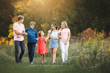 Five siblings walking together during a photo session in Northern VA