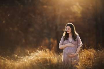 tall grass maternity portrait backlit