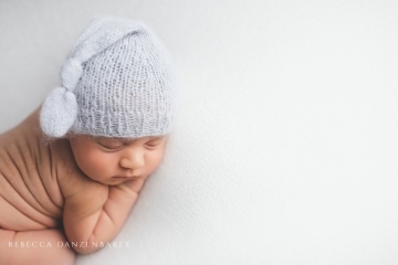 Newborn baby back rolls in Northern VA photography studio