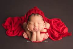 Newborn in froggy pose with smile Newborn in froggy pose with smile