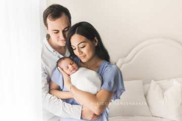Newborn baby being snuggled by his parents in Northern VA photography studio