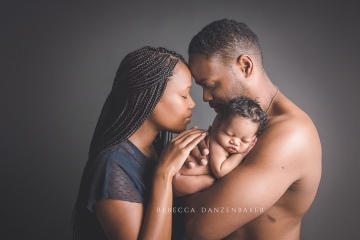 Newborn baby with parents photography