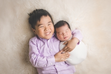 Newborn baby with brother