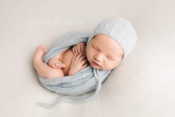Newborn portraits with baby blue props